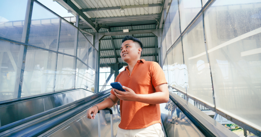 Person holding phone in airport